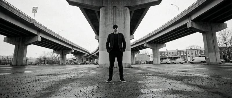 High-Contrast Documentary Photo Under a Brutalist Overpass