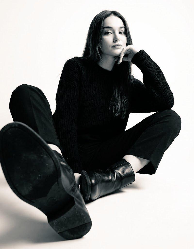 Floor-seated all-black studio portrait: GPT Image 2 prompt