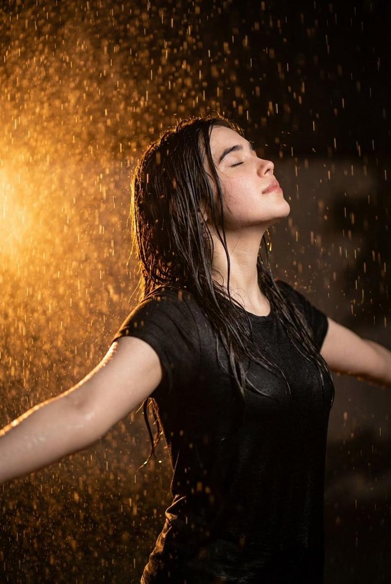 Orange backlit rain portrait: GPT Image 2 prompt