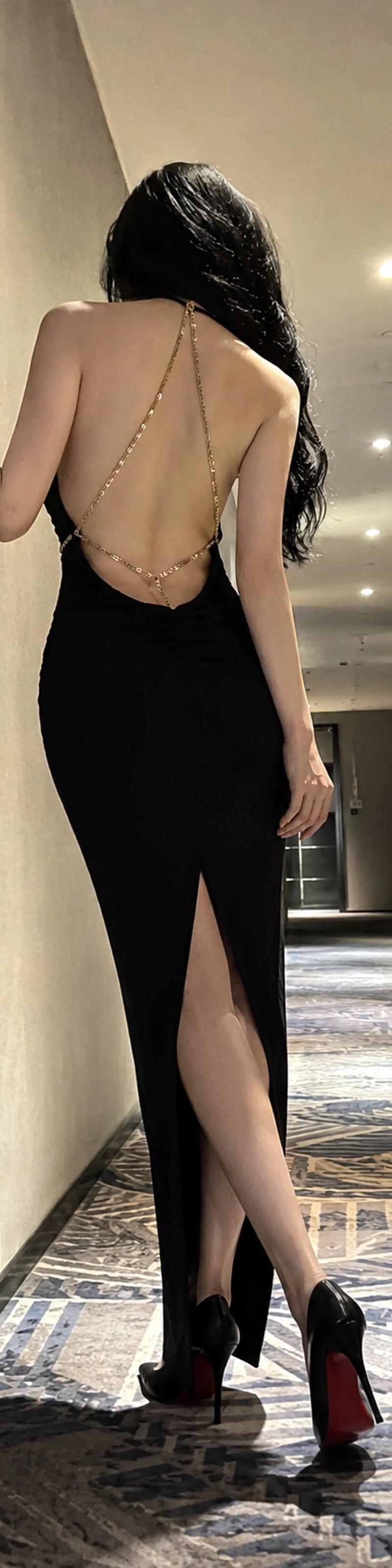 Rear-view hotel corridor black dress: GPT Image 2 prompt