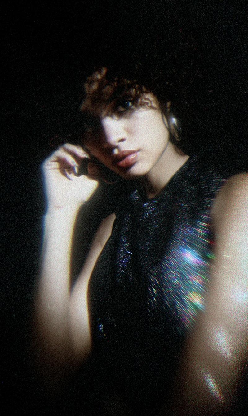 a woman who looks like this in an experimental dark prism aesthetic style polaro