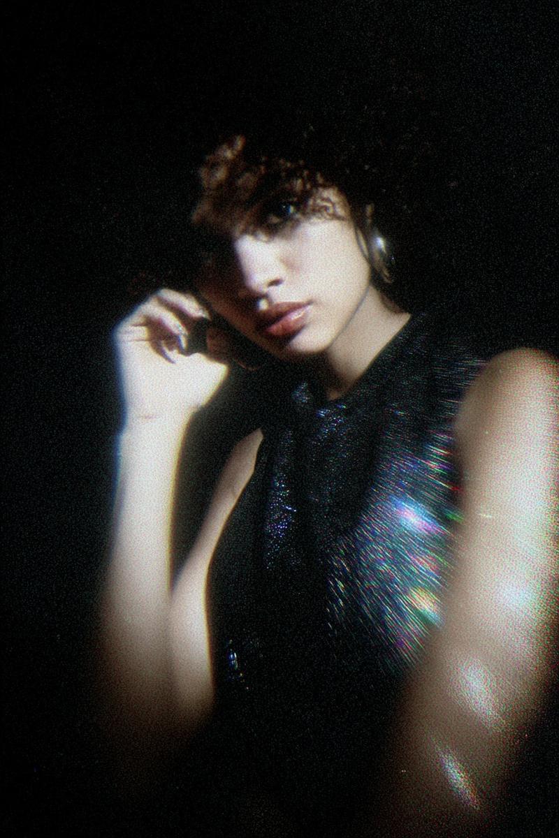 a woman who looks like this in an experimental dark prism aesthetic style polaro
