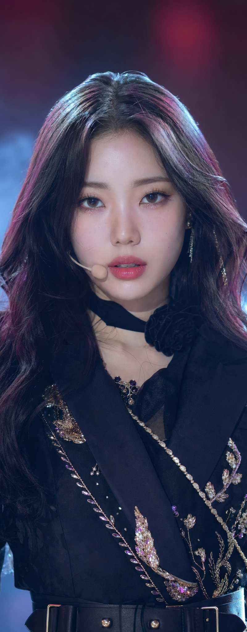 A captivating, head-on studio portrait of a beautiful K-pop idol showcases her n