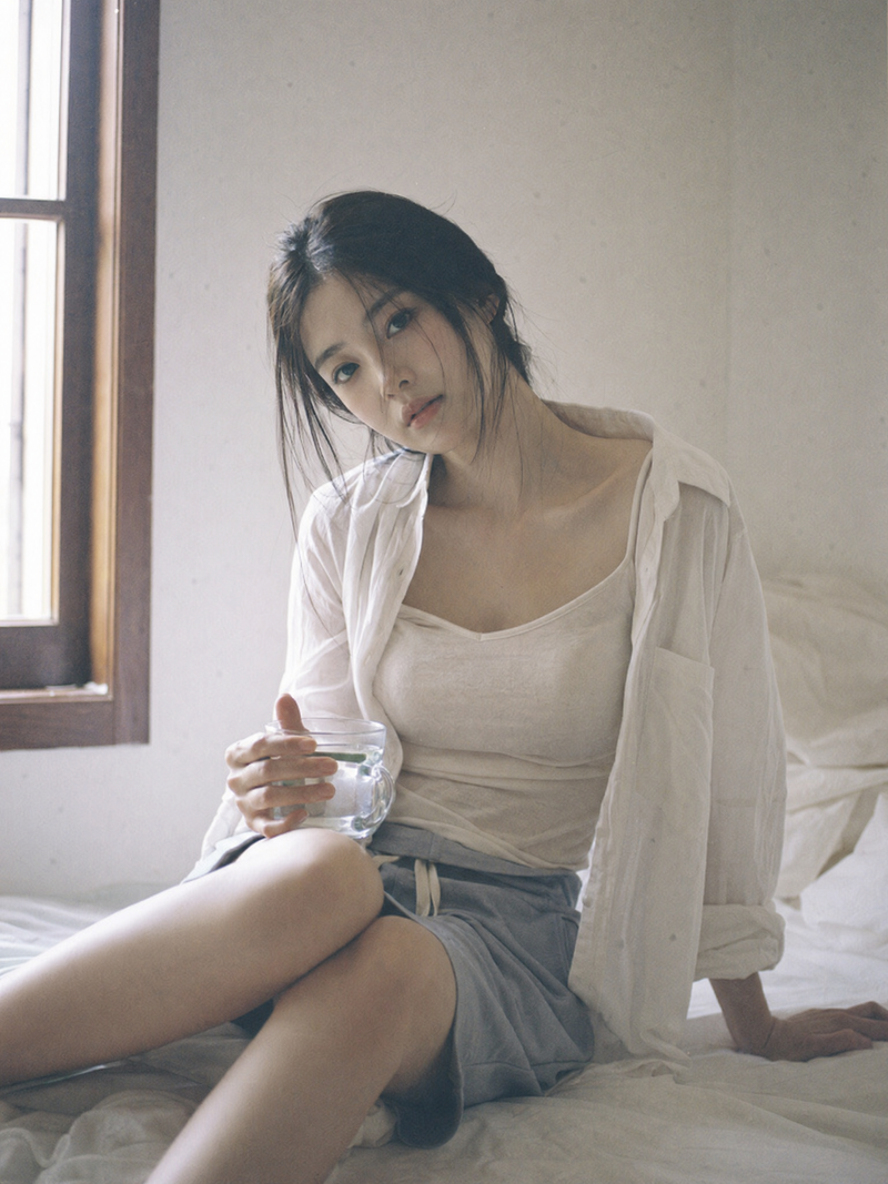Japanese negative film aesthetic, quiet indoor corner, soft natural light, sligh