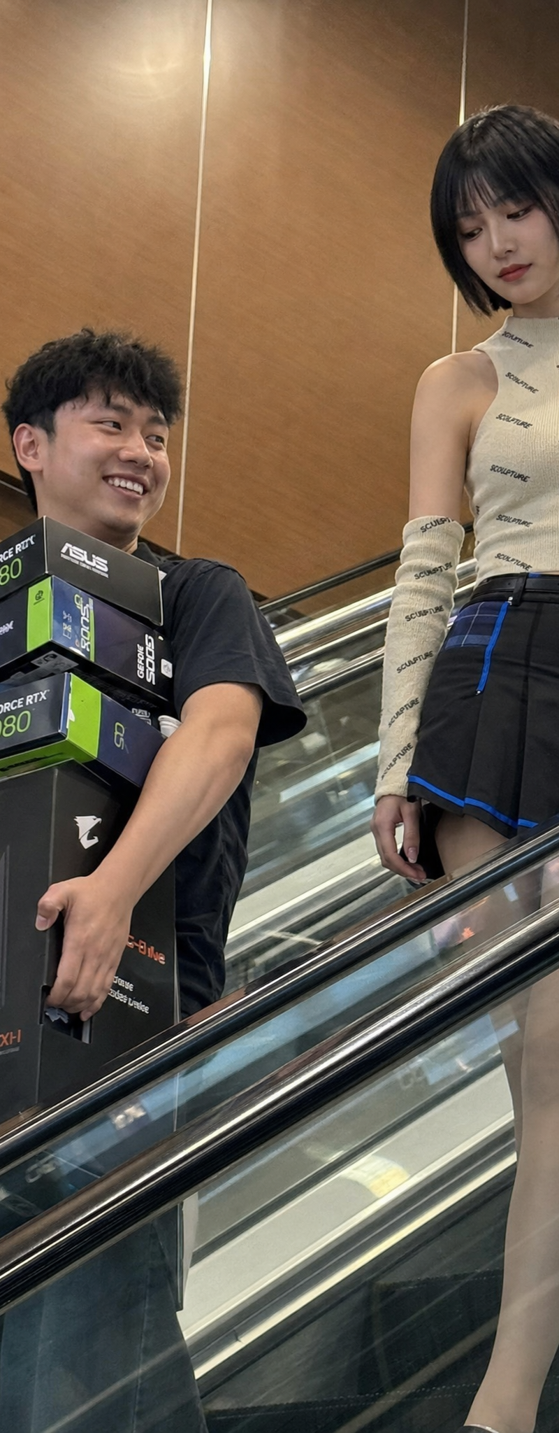 Create a realistic low-resolution candid phone photo of two young adults descend