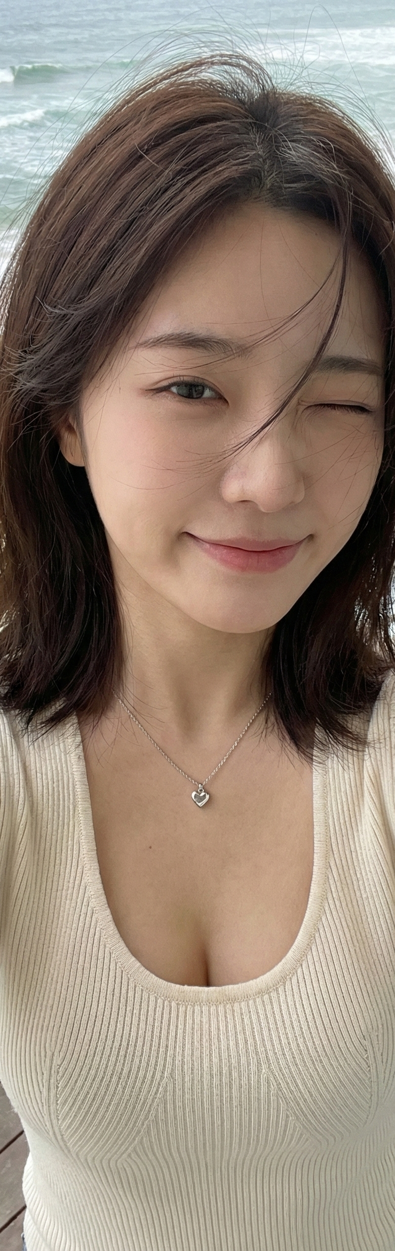 { "subject": { "description": "A young Asian woman taking a high-angle selfie on