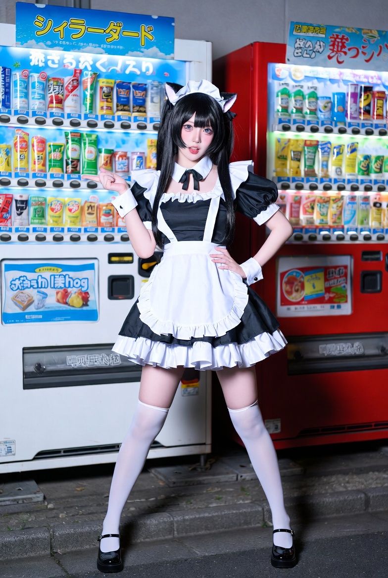Subject: A young woman in a Japanese-style cosplay look, with long straight blac