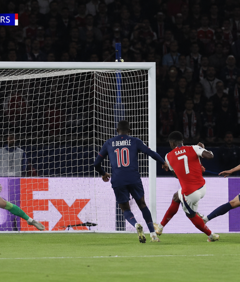 Create a photo-shot, where Bukayo Saka of Arsenal scores the winning goal of fin