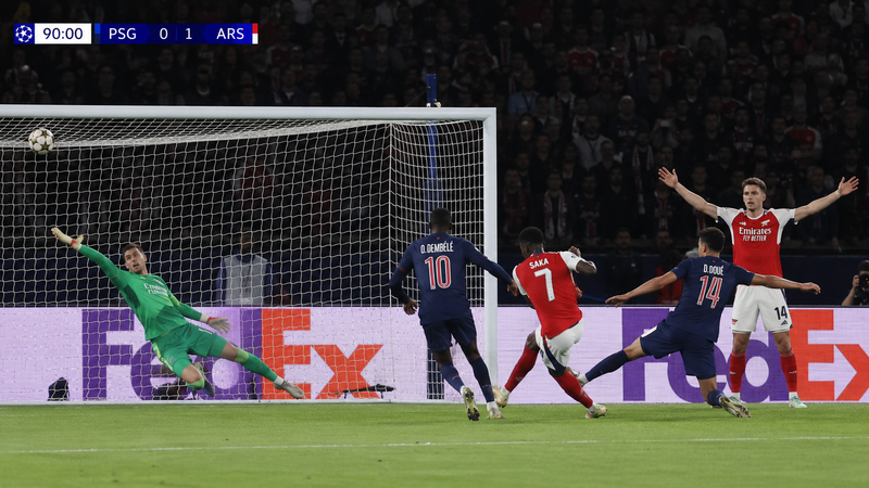 Create a photo-shot, where Bukayo Saka of Arsenal scores the winning goal of fin
