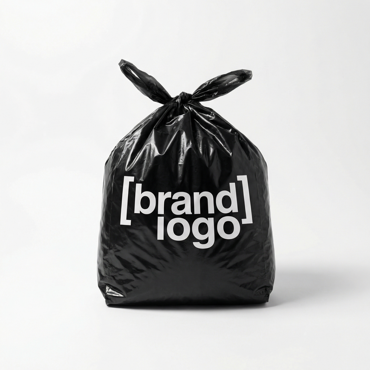 [brand name], minimalist studio product photo, single black plastic bag tied at 