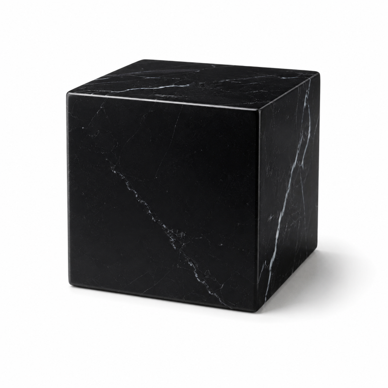 Minimal black marble cube on a white seamless studio background, soft shadow, pr