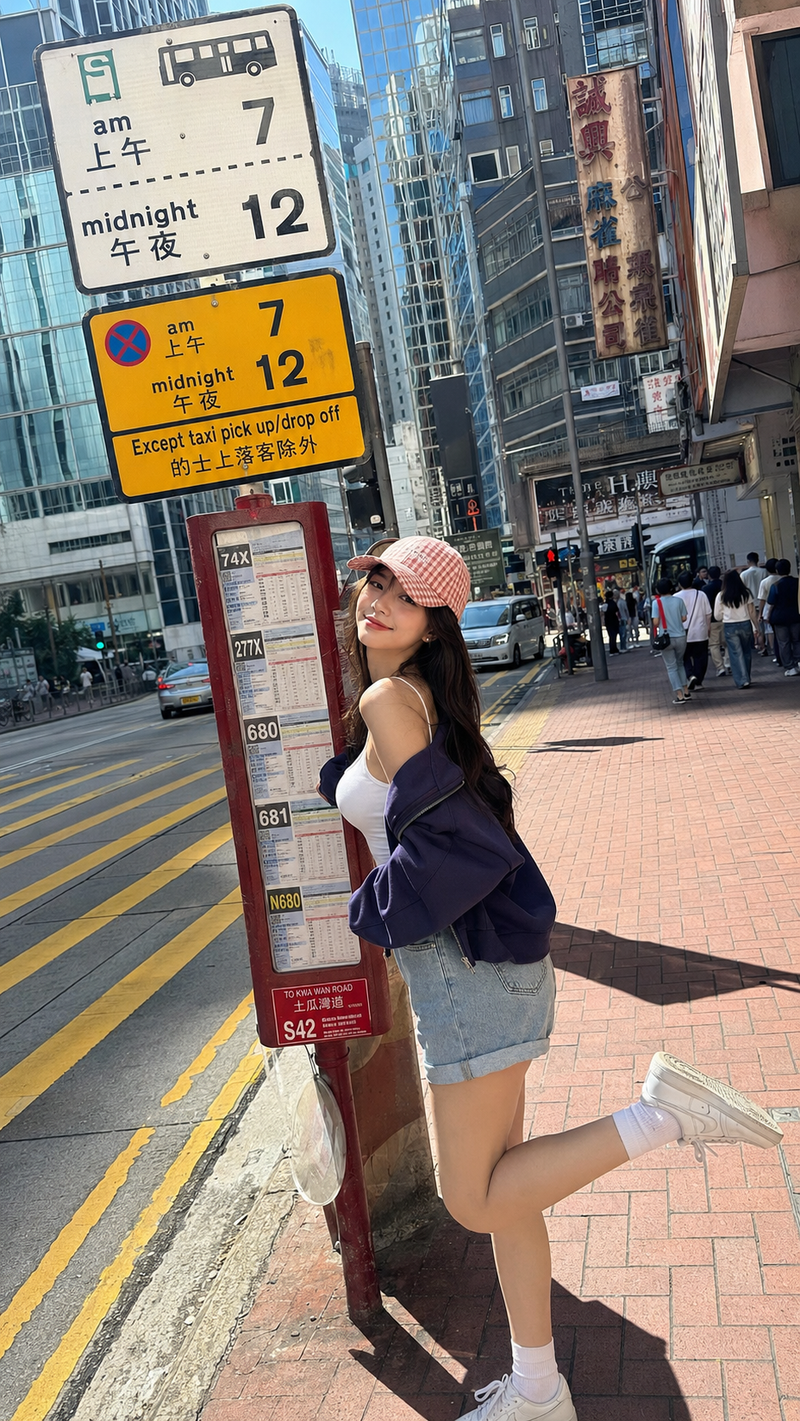 A realistic vertical 9:16 full-body smartphone street photo of a young adult wom