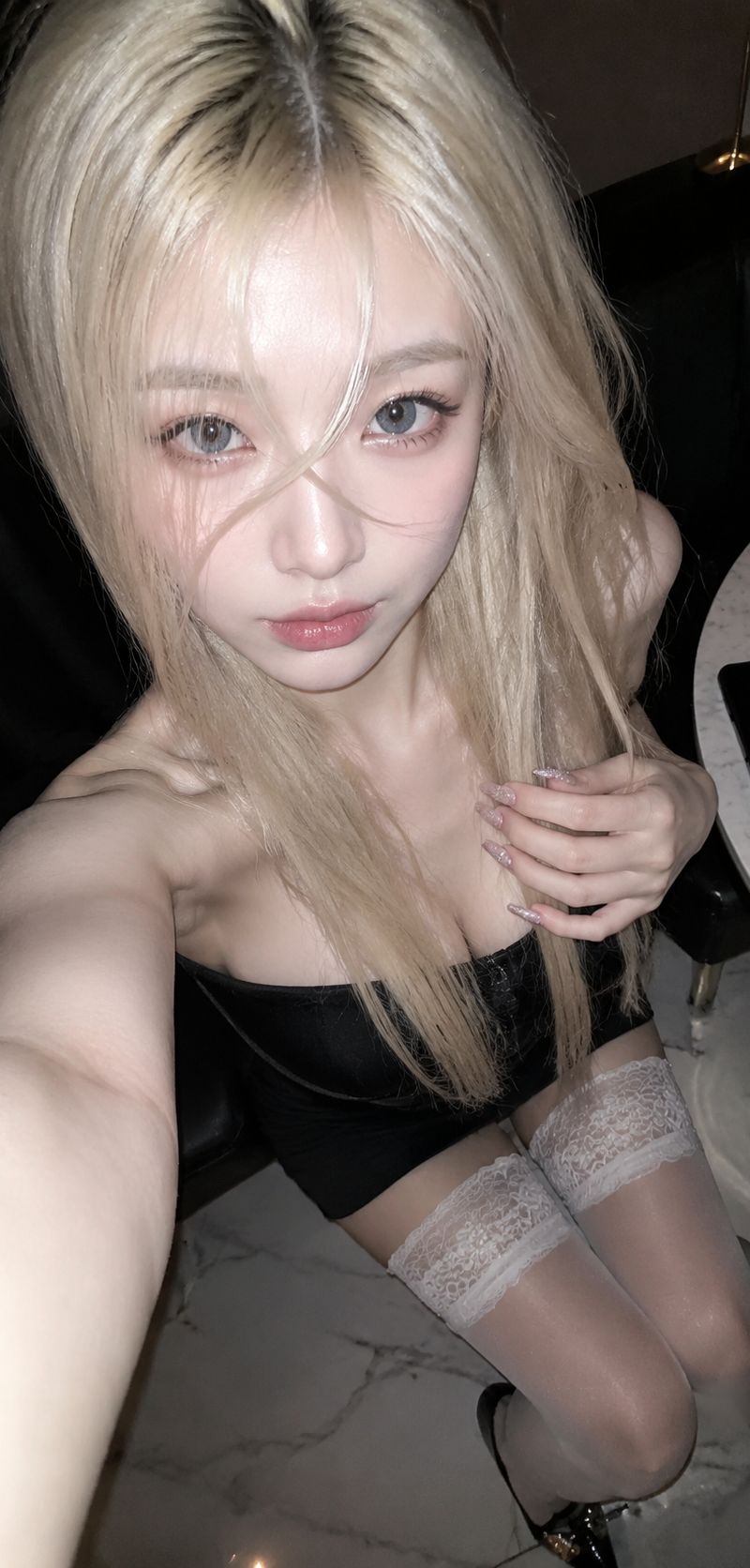 A realistic vertical 9:16 phone selfie, shot from an extremely close high angle,