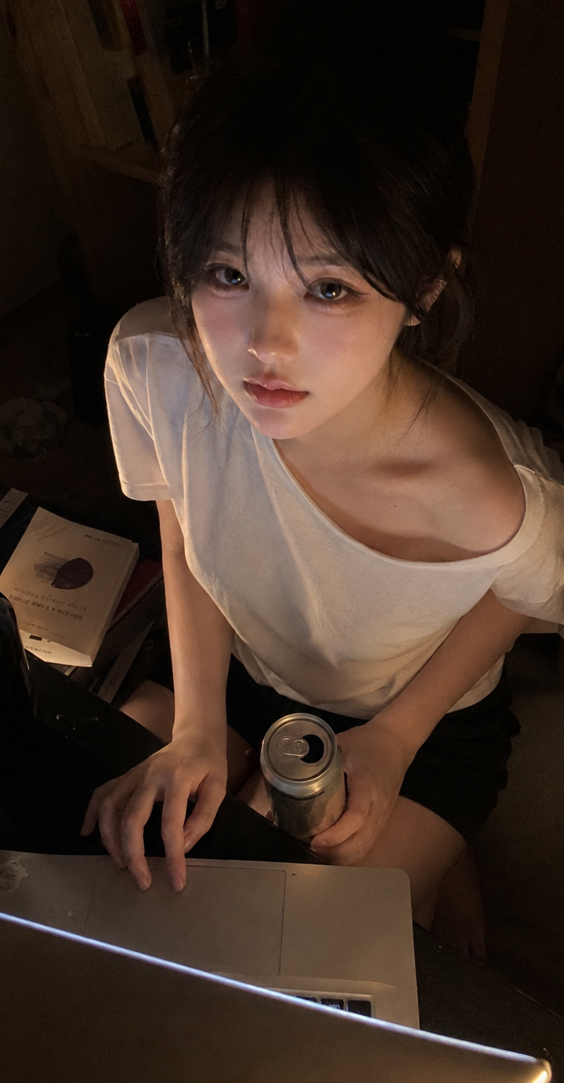{ "subject": { "description": "A young adult woman sitting beside a low table in