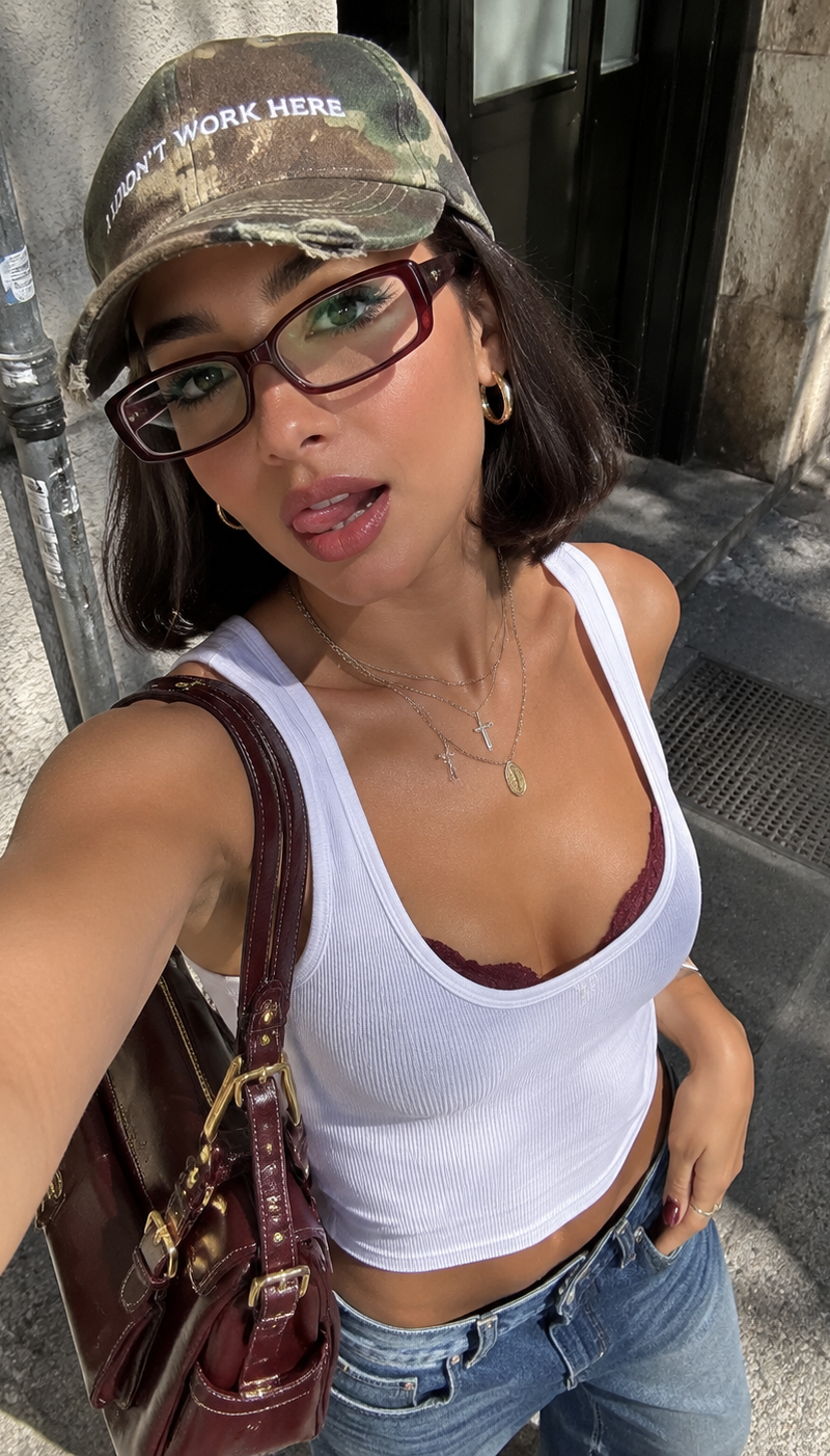 Ultra-realistic fashion selfie portrait of a stunning young adult woman captured