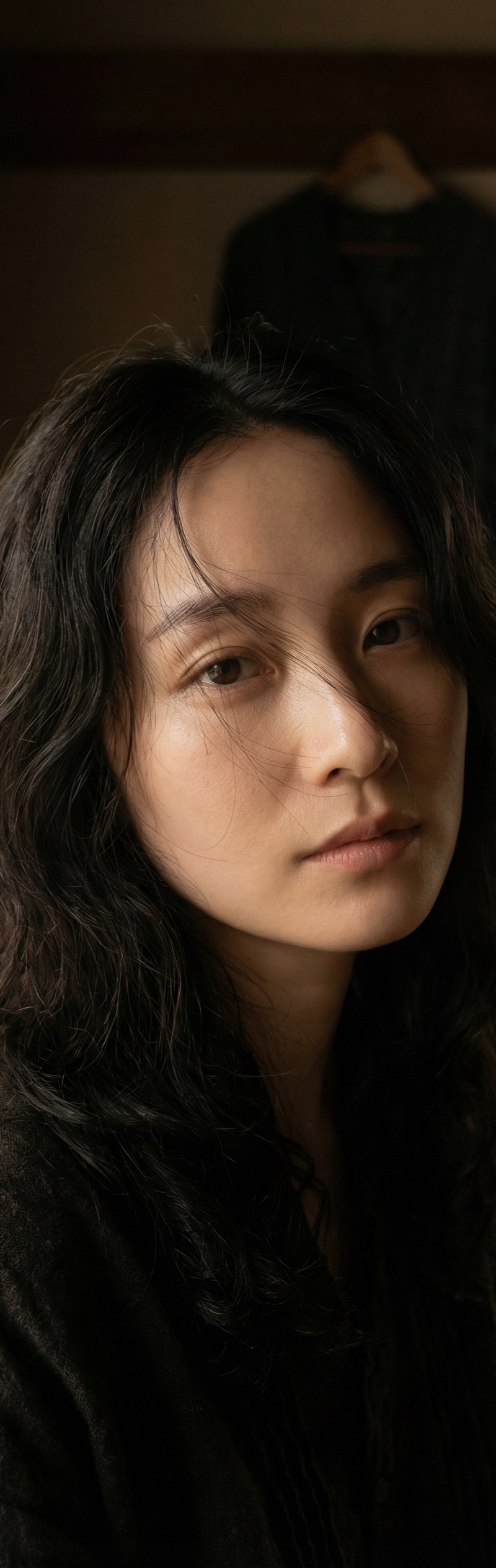 A close and intimate gaze captures a visage of striking, ethereal beauty, envisi