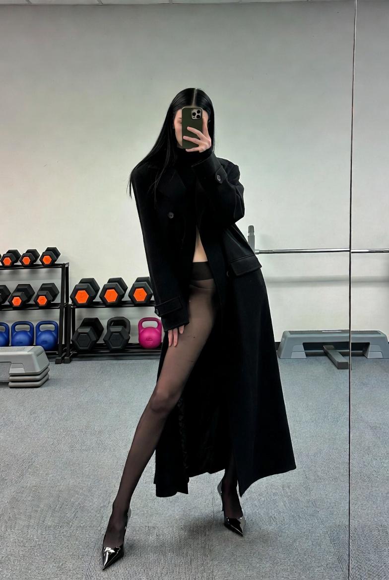 { "subject": { "description": "A tall, slim young woman captured as a dark silho