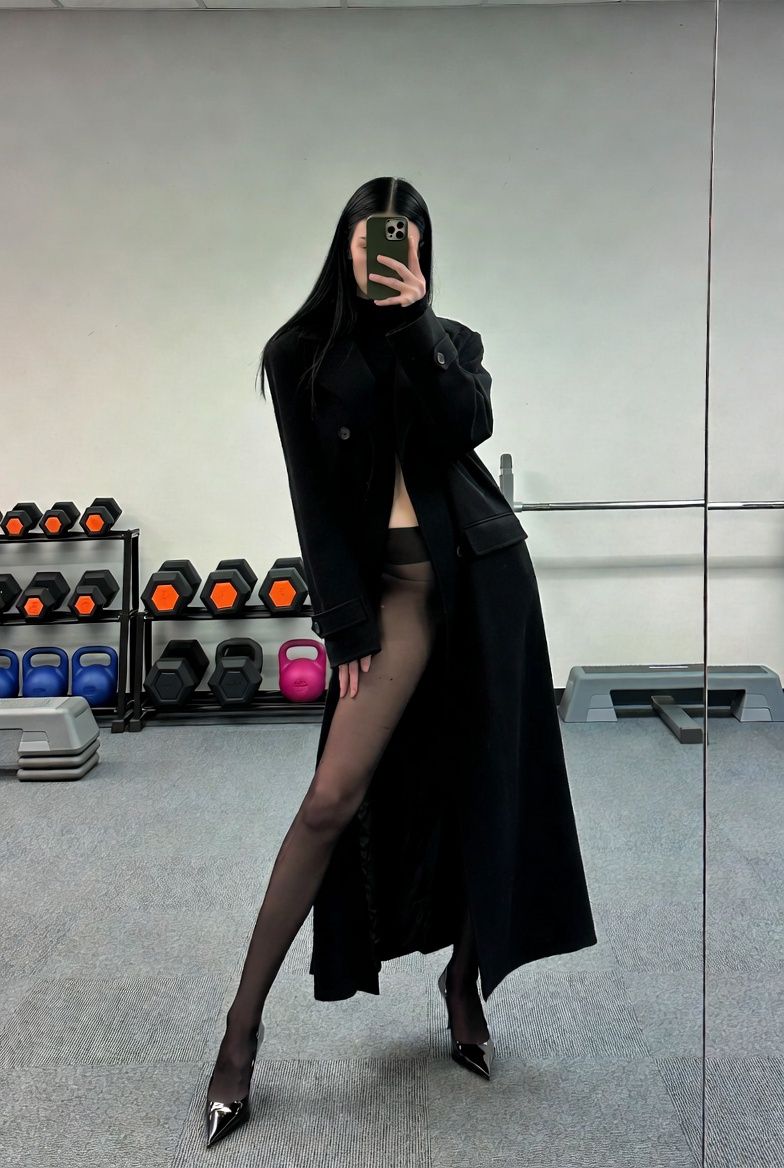 { "subject": { "description": "A tall, slim young woman captured as a dark silho
