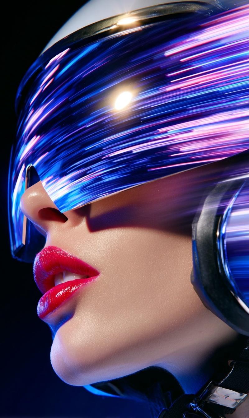 A close-up profile of a retro-futuristic female pilot wearing a chrome helmet wi