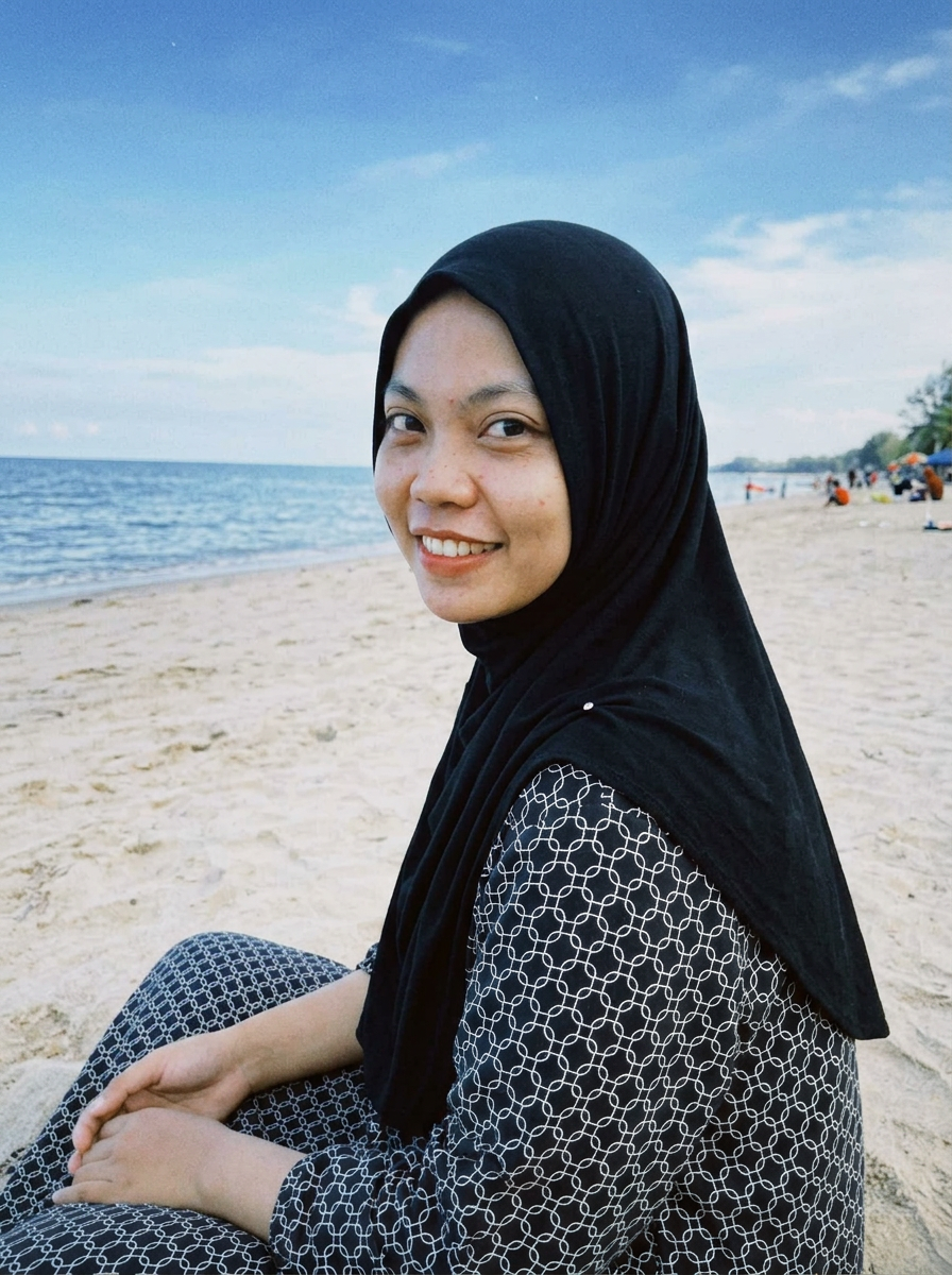 { "subject": { "description": "A young adult woman sitting on a sandy beach with