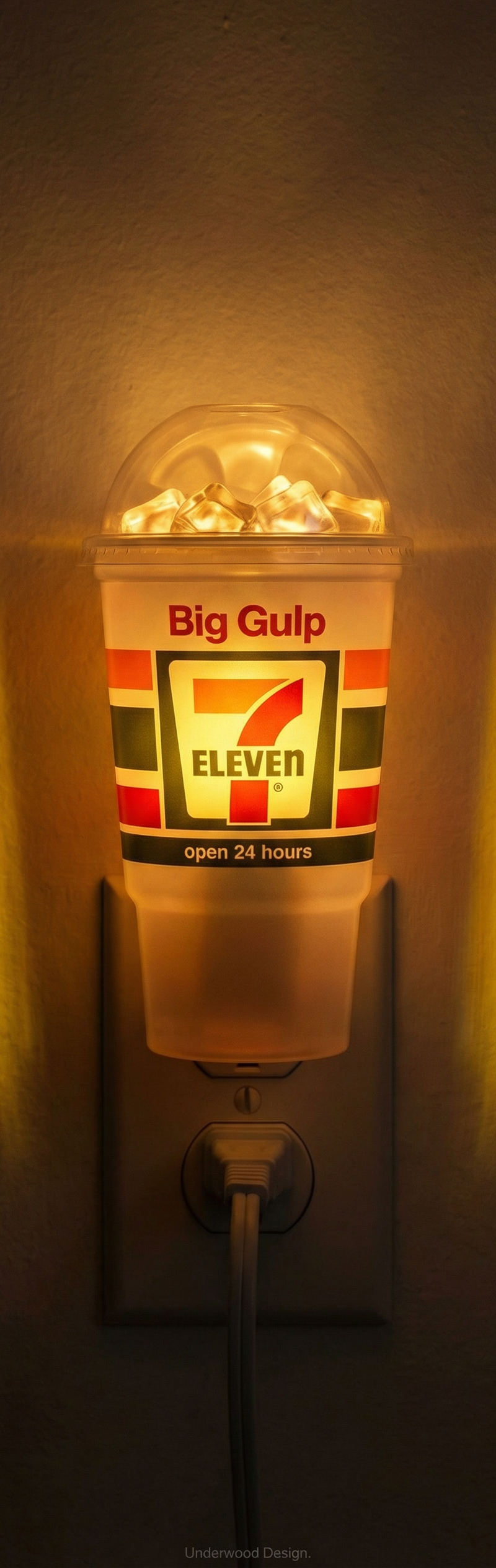 The creative poster features a 7-Eleven Big Gulp cup transformed into a nightlig